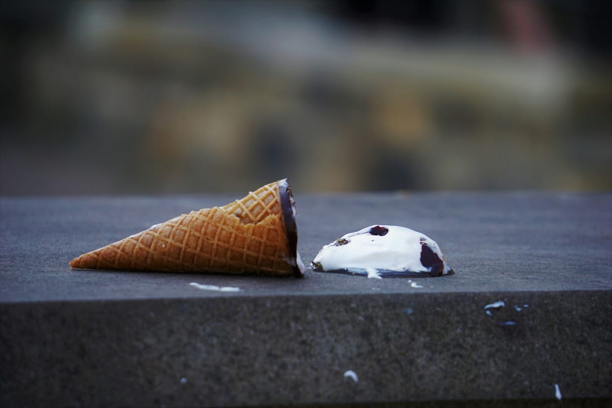 ice cream cone dropped on the sidewalk