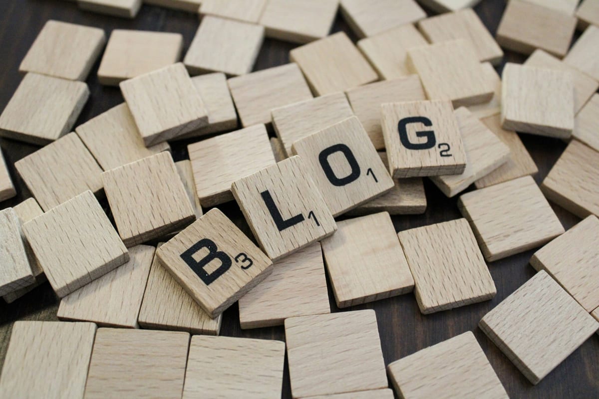 Scrabble tiles that spell out "blog"